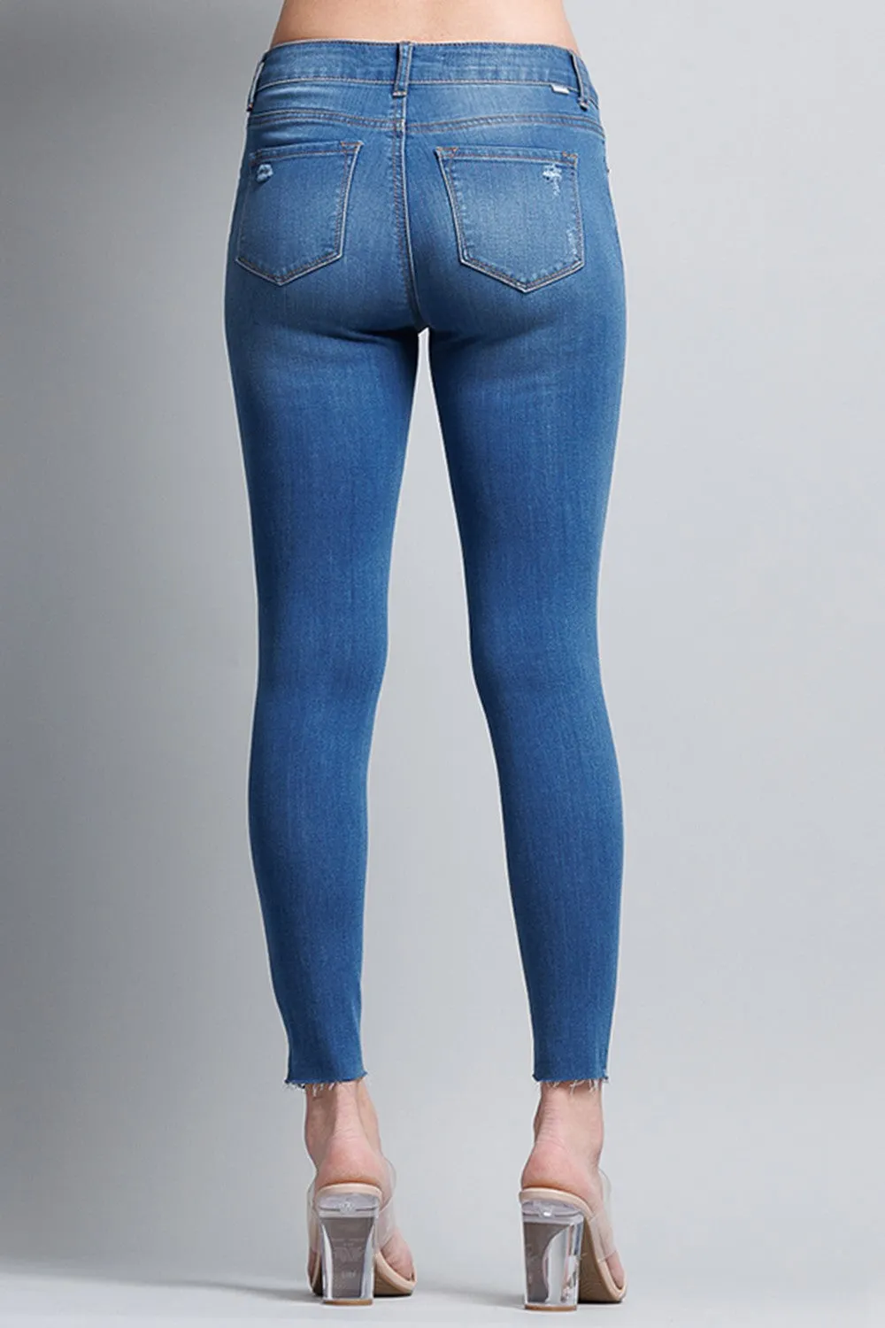 Distressed Mid Rise Skinny Jeans with Chewed Hems